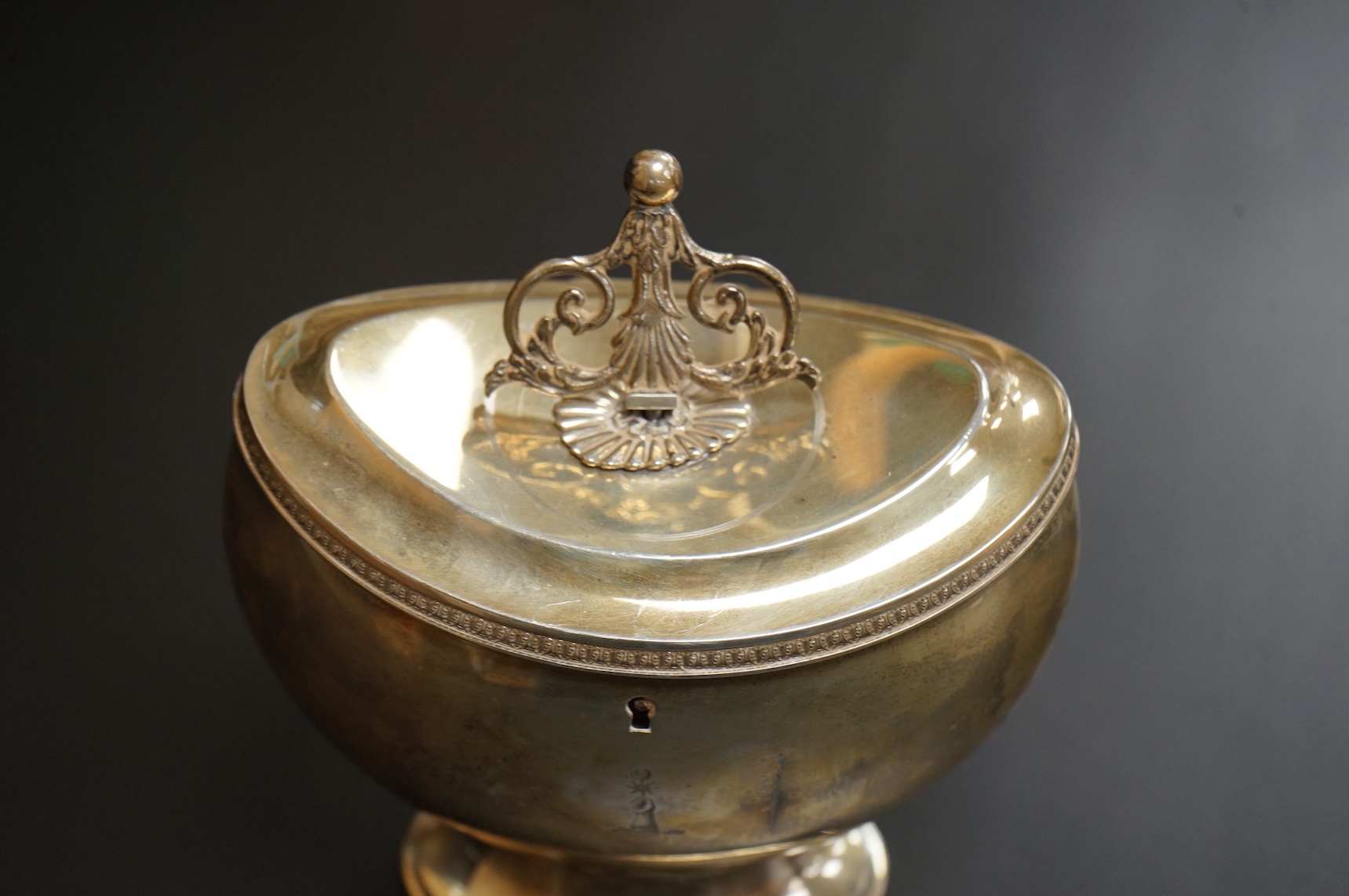 A late Victorian demi-fluted oval tea caddy, by William Hutton & Sons, London, 1894, width 11.1cm, together with a 19th century continental white metal oval tea caddy, possibly French, no key.